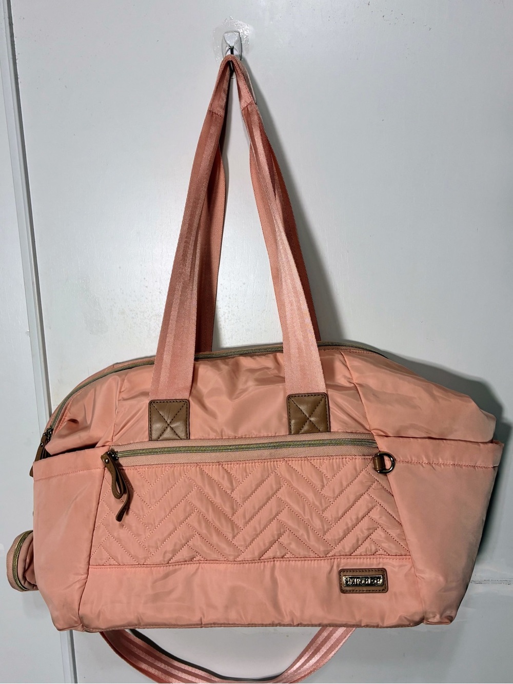 Skip Hop Suite 6-In-1 Diaper Bag in blush pink with quilted details. EUC